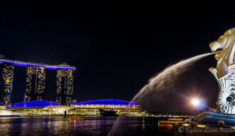 The Merlion statue and a view to Marina Bay Sands Hotel